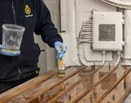 Handrails being varnished. 
