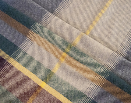 A tartan lambswool throw in one of the Fingal cabins. 