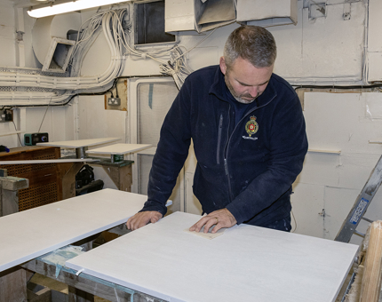 Sanding panels which are being manufactured.