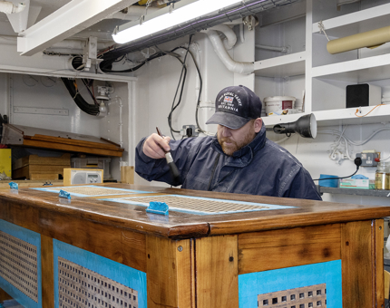Varnishing the rope box. 