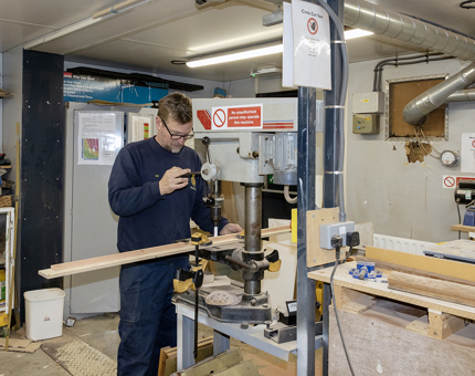 Cutting hinge plates for the wardrobes aboard Fingal