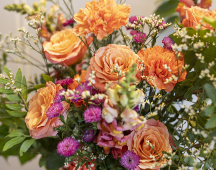 A close up of Flowers In Autumnal Shades Adorning The Drawing Room