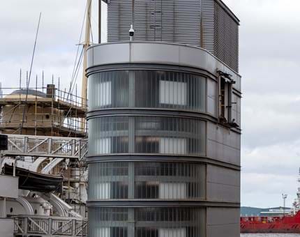 Scaffolding around the ship's funnel and the visitor lift tower. 
