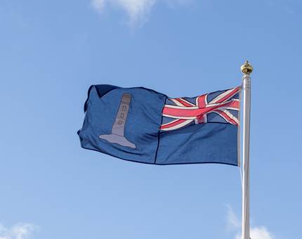 The ensign of the Northern Lighthouse board with a union jack and lighthouse emblem. 