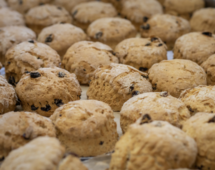 A plate of fruit scones on a tray. 