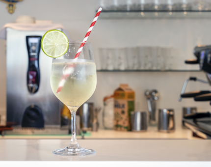 A glass of a special, the Britannia spritz sits ready to be served on the counter.