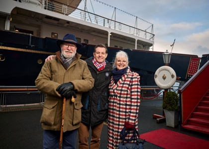 The Royal Yacht Britannia from the quayside, Matt Baker and his mum and dad are standing in front of the ship. 