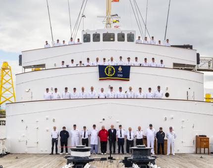 The ex-Royal Yachtsmen lined up across the decks at the front of Britannia in the Port of Leith. 