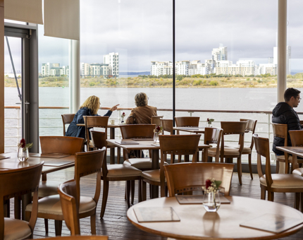 Visitors Enjoying Views Over The Port Of Leith From The Royal Deck Tearoom's large picture windows. 