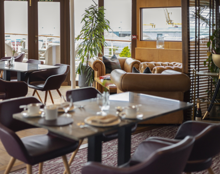 Tables set in the Lighthouse Restaurant aboard Fingal Hotel in Edinburgh.
