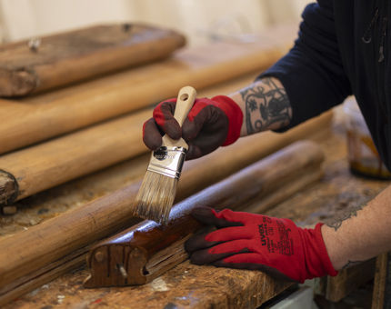 Sean varnishing handrails.