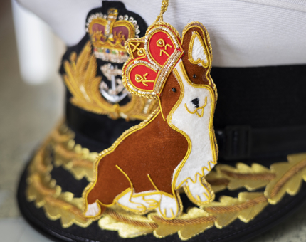 Corgi Hanging Decoration sitting on a captain's hat.