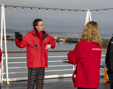 Visitor Assistant, Alex, taking Housekeeping team on a tour to learn the history of Britannia.