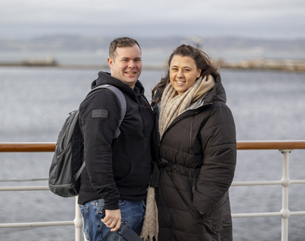 Couple posing for a photo on the Bridge