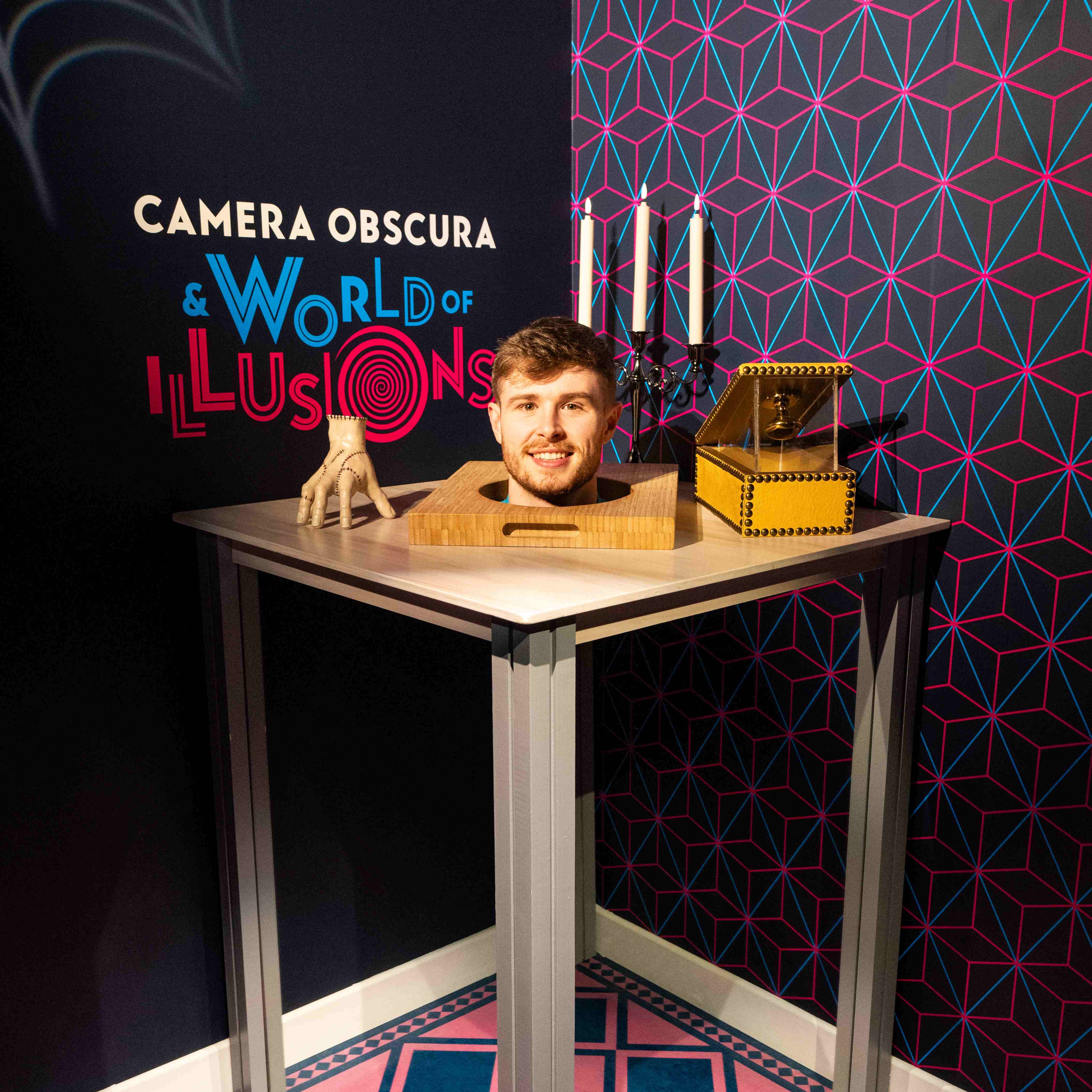 At Camera Obscura world of Illusions in Edinburgh. There is an optical illusion of a head on a table.