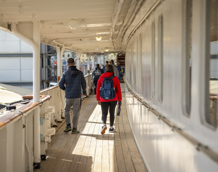 A view of visitors walking down the the deck of Britannia. 