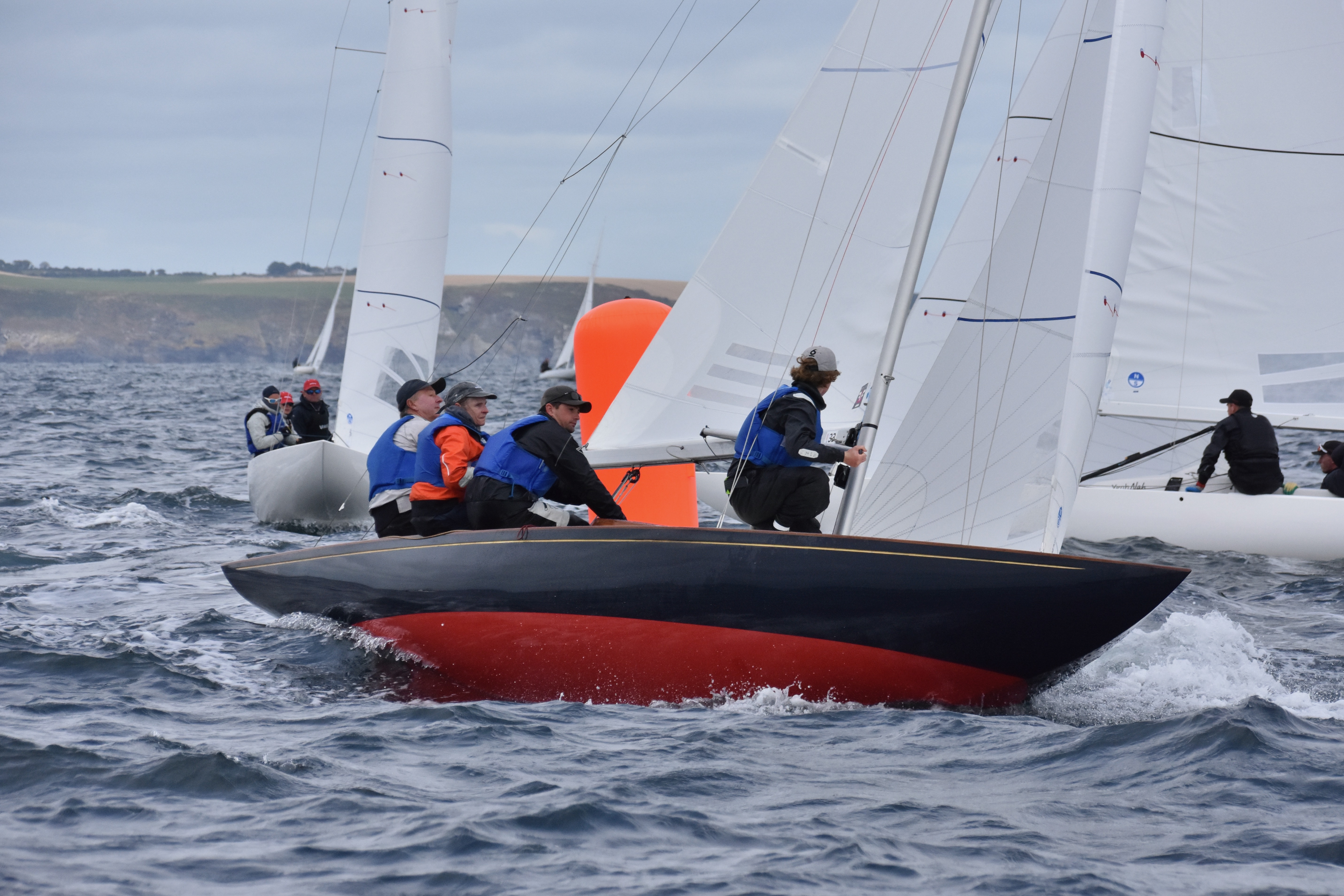 A crew sailing a royal racing yacht 