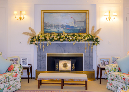 A fireplace mantel with Christmas decorations on it 