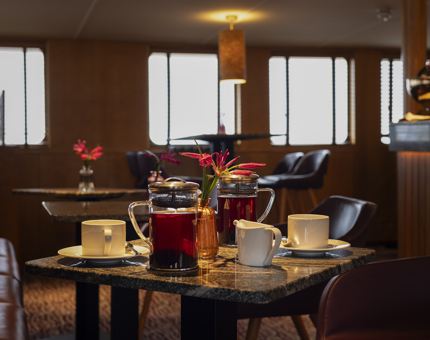 Aboard Fingal Hotel in the Port of Leith, a table in the Lighthouse Restaurant is set for 2 people to have coffee. 