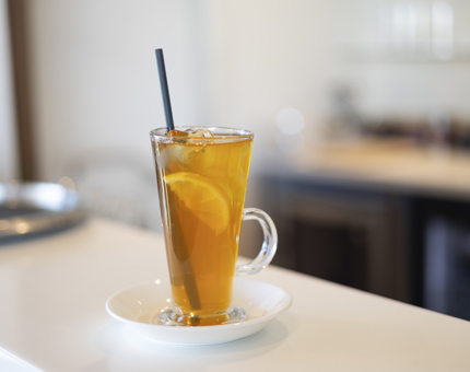 A tall glass of iced tea. 
