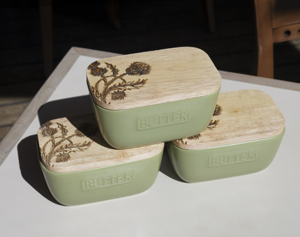  Three green Thistle Butter Dishes. The lid has an image of a thistle flower on it. 