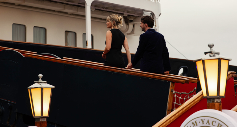 Couple walking onto a ship