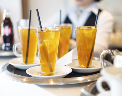 A tray of iced teas. 