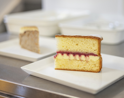 A slice of Victoria sponge cake and carrot cake in the Galley. 