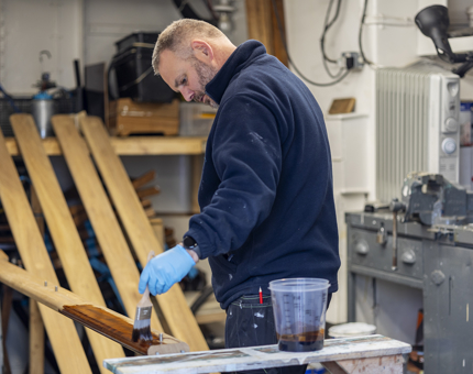  Joss varnishing handrails for Fingal Hotel.