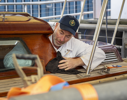 A Yottie cleaning the Royal Barge.