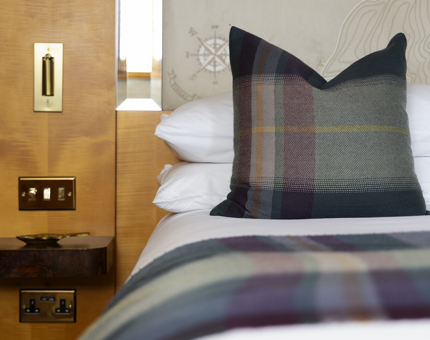  A detail of a bed in a cabin aboard Fingal with Amarinta Campbell tartan. 