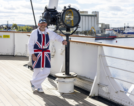 A Yottie wearing a union Jack apron is taking a break on the Bridge. 