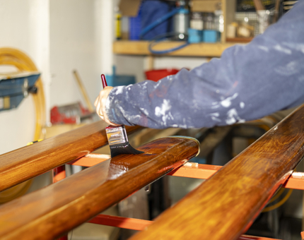 A closer look at handrail varnishing by a member of the team. 