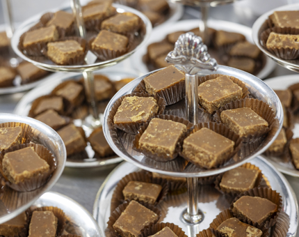 Stands of tablet petits fours to be served at an event aboard The Royal Yacht Britannia. 