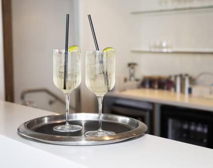 Two glasses of Elderflower Spritz on a tray in the Royal Deck Tearoom. 