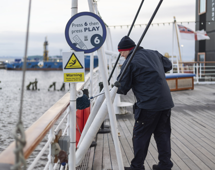 Facilities Officer, Mark, cleaning the Verandha Deck