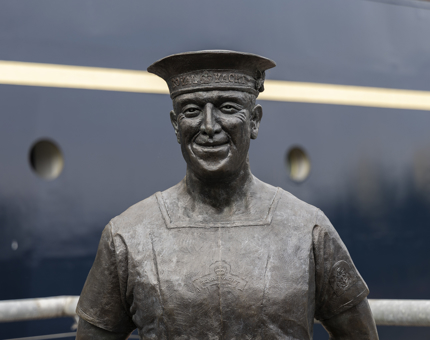 A statue of an ex Royal Yachtsmen, Ellis ‘Norrie’ Norrell, whoch is positioned beside Britannia on the quayside. 