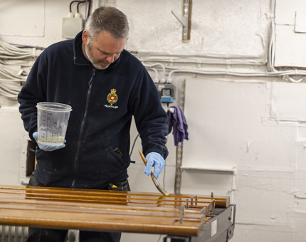 Joss varnishing handrails from Fingal Hotel.