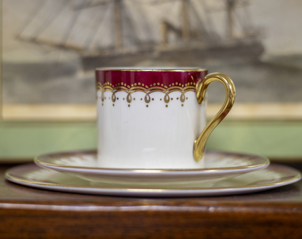 A china mug, saucer and plate. 