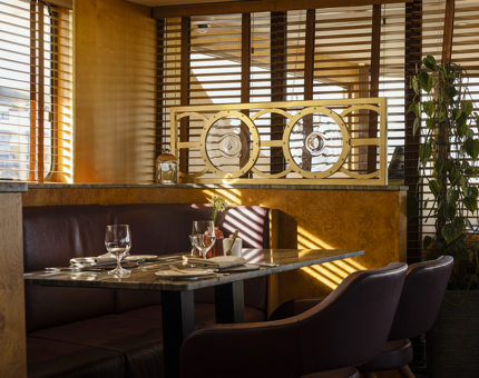 Sunlight streaming through the window onto a table in the Lighthouse Restaurant. 