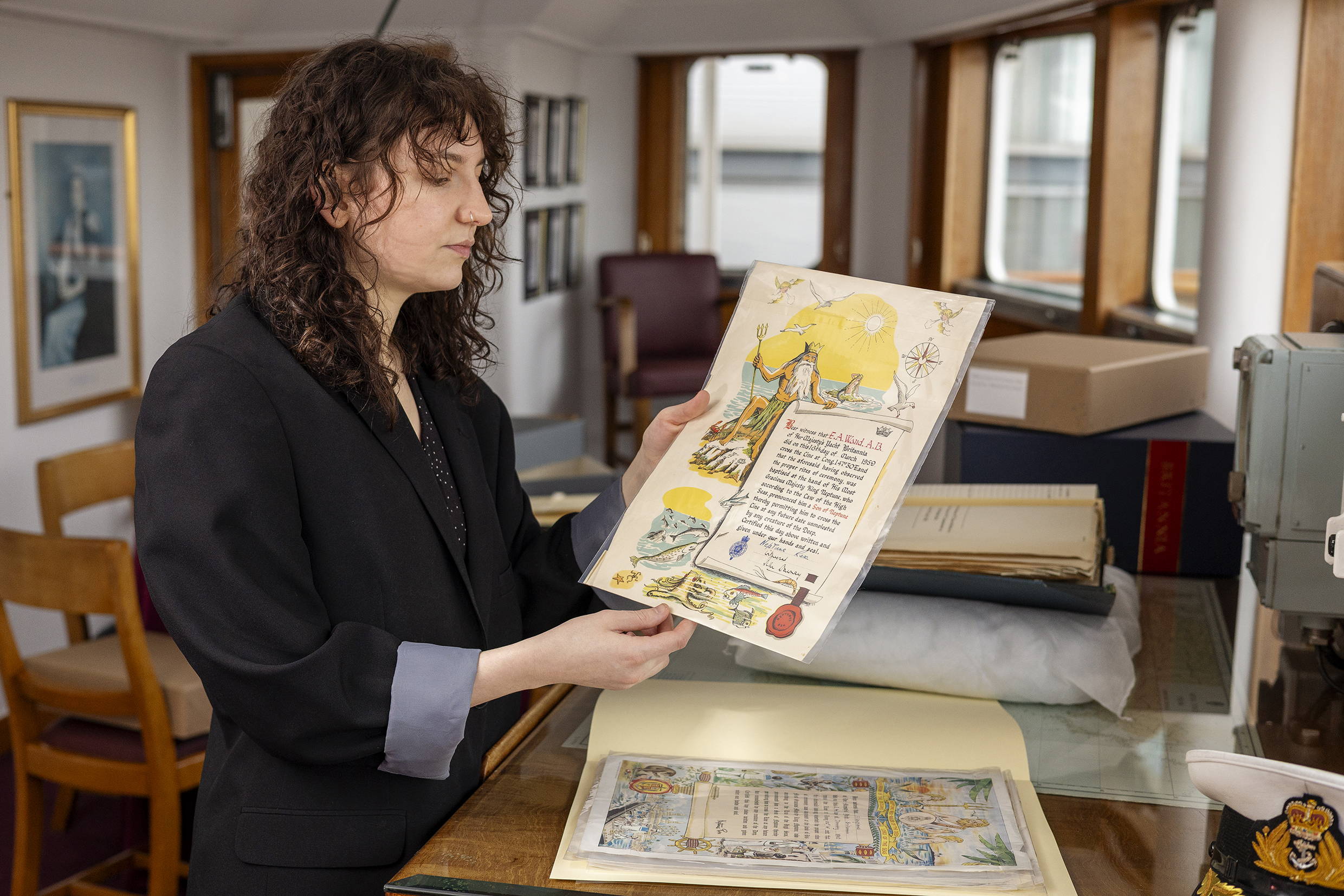 Eavey the archivist with an illustrated document