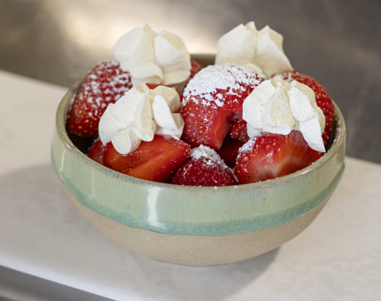 A bowl of Strawberries and Cream for afternoon tea aboard Fingal Hotel. 