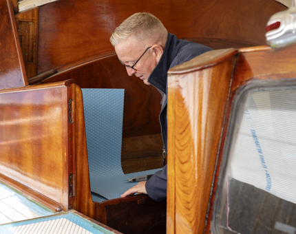 On the Royal Barge a Maintenance team member is installing anti-slip treading. 