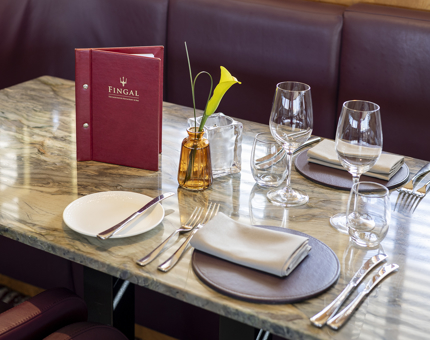 A table in The Lighthouse Restaurant & Bar is set for dinner. 