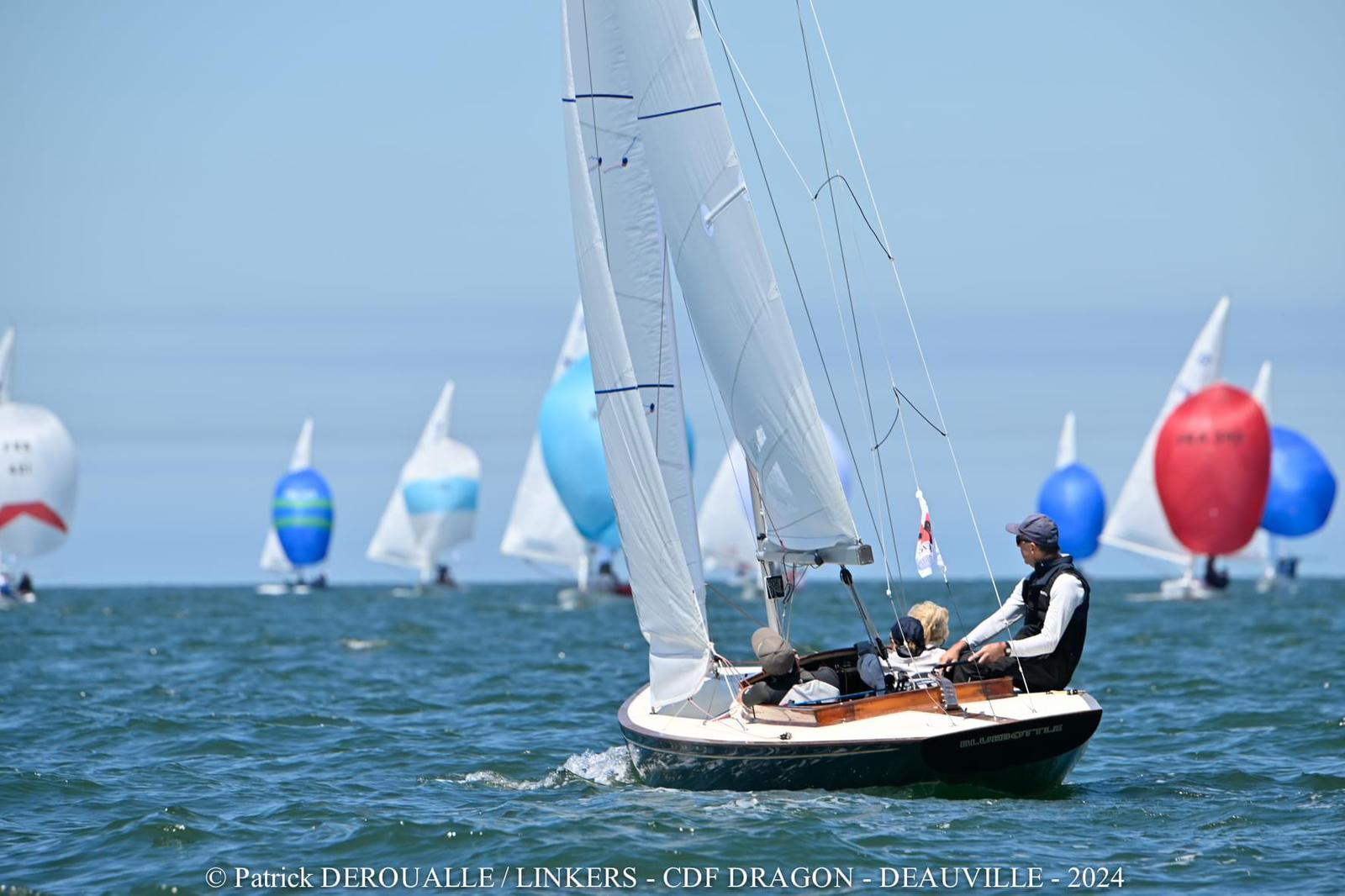 royal racing yacht on the water with crew