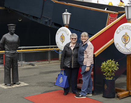 Two ladies standing at the bottom of the Royal Brow posing for a photo. 