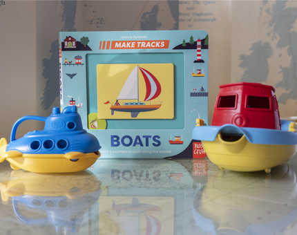 Two submarine toys and a boats book. 