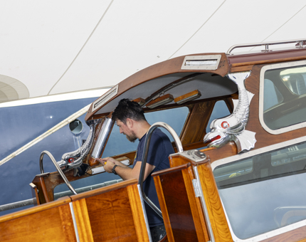A Maintenance man Working On The Royal Barge in the Port of Leith. 