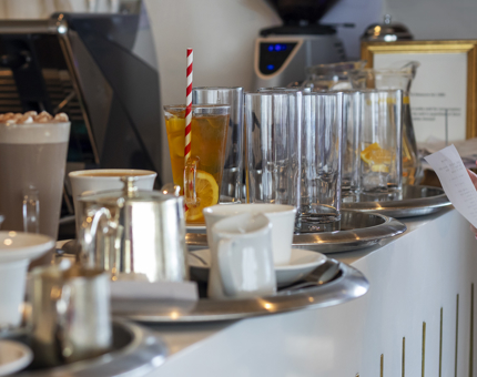 The bar in the Tearoom is busy with trays of drinks to be served. 