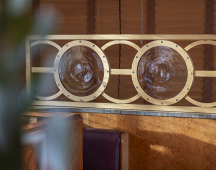 The Lighthouse Restaurant & Bar nautical details in the seating area.